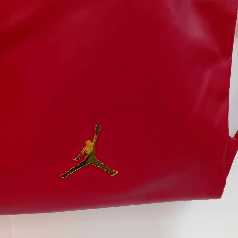 JORDAN Red Faux Leather Drawstring Backpack with Gold Jumpman